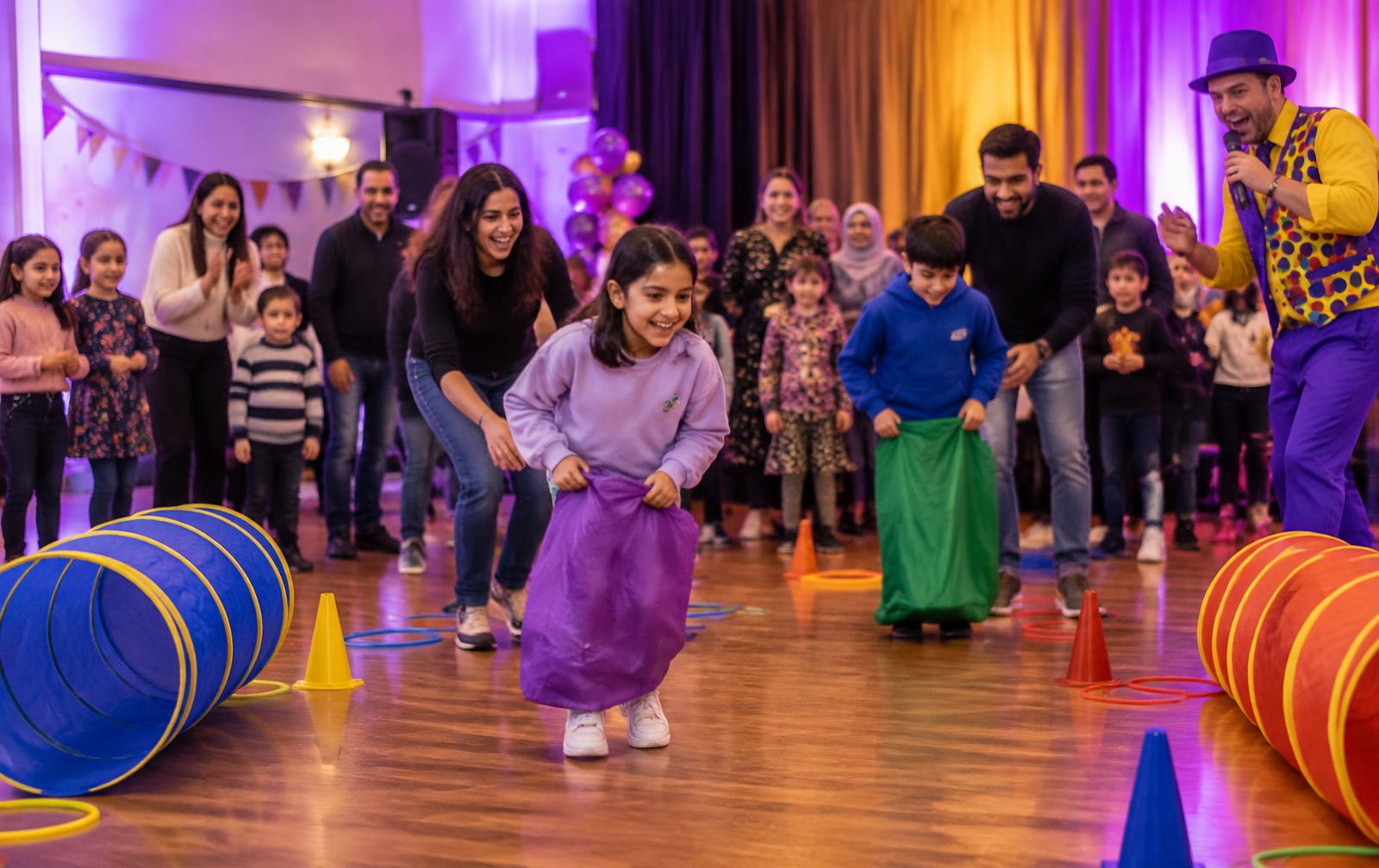 Children and adults taking part in hosted family fun games